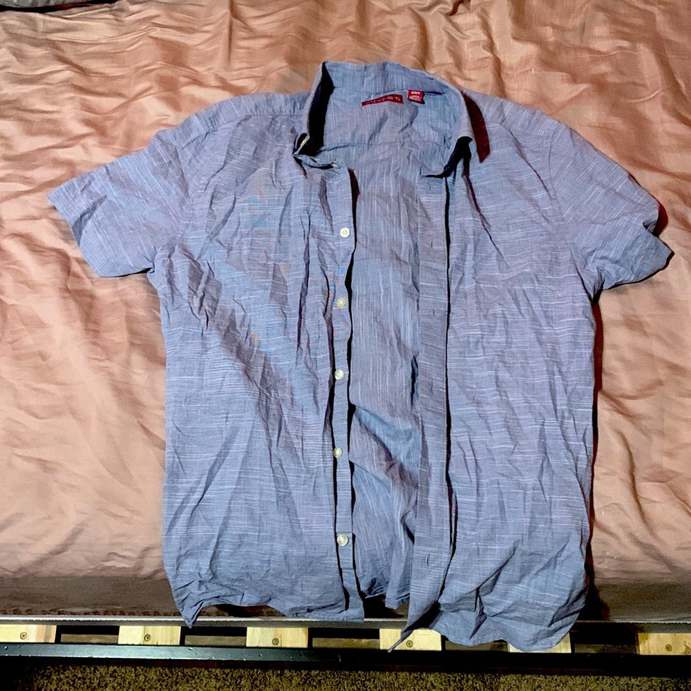 Axial button up. M but tight fit. No flex. Need to clear clothes out